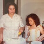 Justina Machado Instagram - Me and my Abuela. I’m sure that’s a cake from Roesers Bakery in Chicago and I’m sure it had some sort of glazed fruit in it. Memories of my beautiful Abuela . I love when I find pictures of her I haven’t seen in a long time. Happy Thursday mi Gente #babyjustina ♥️♥️