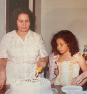 Justina Machado Instagram - Me and my Abuela. 
I’m sure that’s a cake from Roesers Bakery in Chicago and I’m sure it had some sort of glazed fruit in it.
Memories of my beautiful Abuela . I love when I find pictures of her I haven’t seen in a long time. Happy Thursday mi Gente #babyjustina ♥️♥️