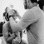 Kara Keough Instagram - Is he embracing my face because watching me give birth makes him fall in love with me all over again? Or is he wiping me off because I had baby cheese all over my face? We’ll never know, but I love you like crazy in either case. In 🤍and in 🧀, @kyleboz.