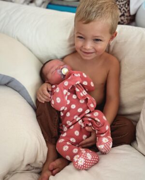 Kara Keough Instagram - “It’s a girl!” Decker announced to an excited room on 11.1.23 at 5:43pm. Baby sister arrived three weeks early like her big brother Vaughn, weighing in at 8lbs 5oz and rocking a full head of dark hair. The first thing I saw was McCoy’s sweet chunky cheeks as we met our newest heaven-sent squish. She came screaming into our hearts and hasn’t stopped squawking since - earning @kyleboz’s best nickname yet: “Squeaks.” I can hear my dad’s voice as he would have said it, so I know it’s just right. Thank you to our birth team @fullcirclejax @4thtrimesterfitnessmethod for the most dreamy induction a girl could ask for - starting with a foley bulb comfy enough to trick-or-treat in (I went as Wonder Woman obviously) and ending with a hasty labor tub transition. The cherry on top was holding hands with Decker the Doula/Birth Photographer-In-Training as I brought her longest held wish earth-side: a baby sister. So many people prayed fiercely over this birth and we are seeping with gratitude that we got exactly what we prayed for: to bring our baby home. If you need me, I’ll be thanking God and pinching myself savoring the magic of Stetson Lou Bosworth.