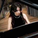 Karen Mok Man-Wai Instagram - 時光荏苒，但願我們對音樂的愛、對生活的愛，每一天都是新的💖 Embracing the fleeting moments, let our love for music and life be a fresh melody every day. 💫 👗 @shiatzychen 💇‍♀️ @carrcheng 💄 @lingchan_makeup 📸 @janshenphoto #莫文蔚 #KarenMOK #piano