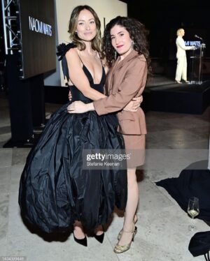 Kate Berlant Instagram - Thank you @elleusa for having me 🤎 Got to celebrate an outrageous group, including @oliviawilde 🤎 (makeup by @kirinstagram / hair by @frizzy.b / the vintage mugler suit is from my closet @muglerofficial hello are you listening? call me)