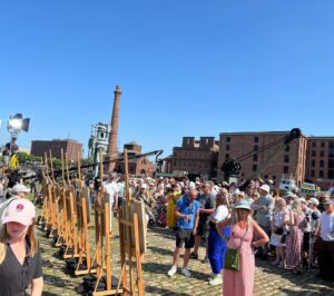 Kate Bryan Instagram - Sky Arts Ice Cream on Location of the year. 🍦 
What a banging day last summer with the good people of Liverpool. Another talented bunch of artists in the pods and well SPF’ed wildcard artists. Yes there were ice creams all round and lots of posing with parasols but it was also a fierce competition and I work very hard ok?! 

Join us at Liverpool docks tonight on Sky Arts at 8pm. 
#laoty #landscapeartistoftheyear #liverpooldocks #tateliverpool thanks to @liz.makeup.11 for keeping me powdered and sun safe ☀️ xxx