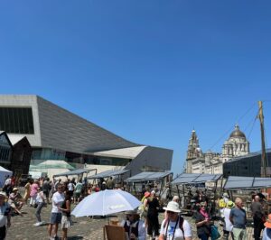 Kate Bryan Instagram - Sky Arts Ice Cream on Location of the year. 🍦 
What a banging day last summer with the good people of Liverpool. Another talented bunch of artists in the pods and well SPF’ed wildcard artists. Yes there were ice creams all round and lots of posing with parasols but it was also a fierce competition and I work very hard ok?! 

Join us at Liverpool docks tonight on Sky Arts at 8pm. 
#laoty #landscapeartistoftheyear #liverpooldocks #tateliverpool thanks to @liz.makeup.11 for keeping me powdered and sun safe ☀️ xxx