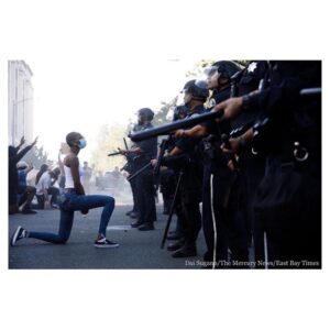 Kate Mara Instagram - Repost from @shaunking
•
Powerful. This iconic image, of a brave young Black woman taking a knee at the feet of a heavily armed police force, was taken yesterday in San Jose. ⁣
⁣
Repost from photojournalist @daisugano⁣
・・・⁣
A protester takes a knee during a #SanJose protest on Friday after #GeorgeFloyd's death in #Minneapolis #GeorgeFloydprotest⁣
On assignment for @mercnews @ebtimes
