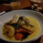 Kathryn Dunn Instagram - a date night at @windmillsbrewery 🥰🍻🫶📚 what I ate👇 🍹 The Haka - a Tiki cocktail with citrussy bright tequila, subtle notes of vanilla and hints of butterscotch, cola, and dried fig (Alex had the “Smoking Barrel” 💨🥃) 🥘 Fennel & Cumin Crusted Scallops - PERFECTLY COOKED queen scallops with fennel & cumin crust habanero buttermilk sauce 🍗 Hot ‘n Sweet Guava Chicken - sweet and spicy guava-marinated tandoori chicken 🍤 Seafood Moilee - Rainbow trout, shrimp, casava podimas, I WANT TO BATHE IN THE MOILEE SAUCE it was so good 🤤 #grandscapetx #dallasrestaurants #dallasfood #thecolony