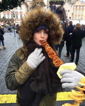 Kathryn McCormick Instagram - Prague!!!! Made it to the Christmas Markets and had to have some chips on a stick! Whatttt!?! So fun!🎄