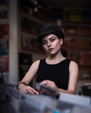 Katie Sarife Instagram - How to look cool: get your picture taken by @b2two in a record shop