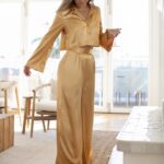 Katrina Scott Instagram – KSL in gold 🥂This set is available now with 2 gifts with purchase— the Carmen Handbag   Del Sol visor… perfect for holiday gifts! 

The Belle pant and blouse are beautiful for holiday celebrations & NYE! These pieces were made for you locally here in LA by all female seamstresses ✨ Shop at KSLthelabel.com 

What should I design next? Leave your requests below ☺️ @ksl.thelabel