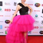 Keegan Connor Tracy Instagram - Finally managing to post red carpet pics from the @ubcp_actra awards! I can’t help it, this pink skirt just brings me joy. And I love the picture that sneak pic of me speaking to @iamkyleguerrero and Louis Wei about our recent film @theworstdayeverfilm which I directed. Such a fantastic night celebrating the fabulous talent in this city. #yvrshoots #ubcpactraawards #nominee #gala #pinkdress #pink #champagne #actorslife #awards #actress #director #femalefilmmakers @katehewko #katehewko