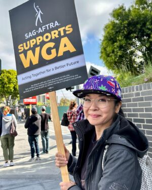 Keiko Agena Instagram - Out at the picket line today at Universal Studio. Wish we could credit the writer that wrote that sign! So many great signs out at the picket line today. @shinkawasaki and I support the writers. 
Fair Wage. Union Strong.
#WGAstrong, #sagaftramember and #1u