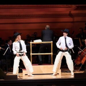 Kelli O'Hara Instagram - #photodump. I’m still misty about this past Friday night with my “partner in crime” @suttonlenore and our evening with @thenewyorkpops led by Maestro @stevenreineke @carnegiehall . There are so many people who made such a grand experiment come off without a hitch, so I must thank them! First of all, the 2 women who inspired the evening (and joined us via
voiceover🥹 ) #dameJulieAndrews and #carolburnett
❤ ❤ . We had wonderful writing and direction by #DickScanlan and additional writing by @katecjames . Our choreographer was the badass @edsciotto and we shared the stage with him and 3 more fabulous friends @ericamansfieldny @sherissespringer and @mrawayne. My right hand man @liptongram was ever by my side as was the incredible #MichaelRafter. It took so much incredible work by folks like our line producer @nikki_fergie and associate director @meganefarley, our orchestrators and everyone @thenewyorkpops to make this happen. I am forever grateful. I also want to thank our stylist @emilysanchezstyle for our #lewks with a huge shout out to @lindsayblockstyle and
@jilloshrymakeup for my #hmu👏 .

My looks in order of appearance:

Opening Dress: @randirahm
Shoes: @stuartweitzman
Bracelet: @Mariajosejewelry
Rings: @shopmodernmoghul

Pink gown with flowers: @Marchesafashion
Shoes: @ninashoes
Rings: @shopmodernmoghul, @itajewelry
Bracelet: @Nadrijewelry

Cowboy look 
Jeans: @everlane 
Shirt: @wrangler 
Boots: Crown vintage co @dsw

Red cocktail dress: @michaelkors
Shoes: @Sam_edelman
Bracelets: @Grownbrilliance, @Aliweissjewelry
Rings: @shopmodernmoghul, @itajewelry 
Earrings: @shopmodernmoghul

Suit: @michaelkors
Shoes: @ninashoes
Rings: @Grownbrilliance
Necklace: @Mariajosejewelry
Earrings: @Nadrijewelry