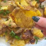 Kelly Kruger Instagram – CRISPY SMASHED SALT & VINEGAR POTATOES 🥔 

Is it a Canadian thing? We put vinegar on our fries in Canada but maybe just a Quebec thing? Somebody help me with this. 

Are u making this? 

Ingredients:
– Yukon Gold mini potatoes
– Olive oil
– Salt
– Malt vinegar

Instructions:
1. Preheat your oven to 450 
2. Place the mini potatoes in a large pot and cover them with cold, salted water. Bring to a boil and cook until the potatoes are tender but still firm, about 15-20 minutes.
3. Drain the potatoes and let them cool and dry them as best as possible (I let mine sit for about 30 min)
4. Drizzle a baking sheet with olive oil. Place the potatoes on the baking sheet and, using a potato masher or the bottom of a glass, gently press down on each potato until it is about ½ inch thick.
5. Drizzle a little more olive oil over the smashed potatoes or spray them with either avocado or olive oil then sprinkle them with salt.
6. Roast the potatoes in the preheated oven for 20-25 minutes, or until they are crispy and golden brown.
7. Remove the potatoes from the oven and transfer them to a serving platter. Drizzle with malt vinegar and sprinkle with additional salt if desired.

#potatoes #easyrecipe #recipeoftheday #glutenfree #frenchfries
