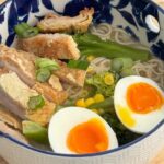 Kelly Kruger Instagram – Gluten Free Ramen bowl!! 🍚 

This is high protein, comforting and delicious. 

Is this a yes or no for you?

Ingredients:
For the broth: (or you can used boxed – I did bone broth here 
– 8 cups water
– 1 onion, halved
– 4 cloves garlic, smashed
– 1 piece of ginger (about 2 inches), sliced
– 1/2 cup gluten-free white miso paste
– 2 tablespoons gluten-free soy sauce or tamari
– 1 tablespoon sesame oil
– 1 tablespoon rice vinegar
– Salt and pepper to taste

For the ramen bowl:
– Gluten-free ramen noodles
– Gluten-free unfried chicken (or protein of choice such as tofu, shrimp, or sliced beef)
– Broccoli, chopped into florets
– Corn kernels (fresh or frozen)
– Green onions, sliced
– Sesame seeds for garnish
– Optional: Soft-boiled or jammy eggs sliced

Instructions:

1. In a large pot, combine the water, onion, garlic, and ginger. Bring to a boil, then reduce the heat and let it simmer for 30-40 minutes to allow the flavors to meld.

2. While the broth is simmering, prepare your gluten-free unfried chicken according to the package instructions. If using tofu, you can pan-fry it until crispy. Set aside.

3. In a small bowl, whisk together the miso paste, gluten-free soy sauce, sesame oil, and rice vinegar until smooth. Set aside.

4. Once the broth is ready, remove the onion, garlic, and ginger pieces with a slotted spoon and discard.

5. Stir the miso mixture into the broth. Taste and adjust seasoning with salt and pepper as needed. Keep the broth warm over low heat.

6. In a separate pot, cook the gluten-free ramen noodles according to the package instructions. Drain and set aside.

7. In the same pot, blanch the broccoli florets and corn kernels in boiling water for 2-3 minutes until they are tender-crisp. Drain and set aside.

8. To assemble the ramen bowls, divide the cooked noodles among serving bowls. Top with the gluten-free unfried chicken, blanched broccoli, and corn kernels.

9. Ladle the garlic miso broth over the noodles and toppings.

10. Garnish with sliced green onions, sesame seeds, and optional soft-boiled eggs if desired.

IB: @michlwellness 

#ramen #ramennoodles #soup #glutenfreefood #easyrecipe #yum #comfortfood #recipeoftheday