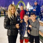 Kelly Preston Instagram - Ice skating at Enchant Christmas Village in St Pete... ♥️ this photo was the extent of my ice-skating last night though… I thought I was a pretty good skater. Was sadly mistaken. I walked out, four steps on the ice and almost killed myself and decided this photo was enough LOL (to be fair, the Zamboni had just turned it into an ice slick and people were flying everywhere 🤣)