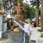 Kelly Tandiono Instagram - Hiking up the pilgrim trail to Xuan Zhang temple the first monk who brought Buddhism to the East Asia Society. He is a prolific writer and a well travelled monk remembered for his 16 years of pilgrimage. He travelled along the silk road on a pilgrimage to India to bring back Buddhist text written in Sanskrit in order to translate it into Chinese. . Bucket list done doing a high kick at XuanZhang Temple with the God of War. 😁✅ . #XuanZhang #ZuanZhangTemple #SunMoonLake #Taiwan #ShotOnOPPO #ShotOnOppoN3Flip