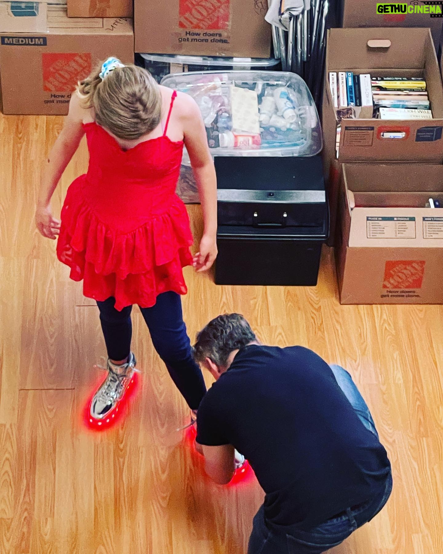 Kim Rhodes - 6.7K Likes - Why, when my husband is so handsome, so camera savvy, is this his birthday photo? Because you don’t understand.
Boxes of our stuff, packed for a move that he was doing because it was best for his family. Tying shoes for his daughter to wear to middle school prom because the shoes were perfect, but the laces still escape her defiant fingers. Photo taken from overhead because wife had gotten a face full of Covid and was waiting it out.
You don’t understand the gift Travis Hodges is to this world. His patient persistence. His eager learning. His kind joy. His ability to keep us safe from the wolves of modern day better than any trained warrior. He is the most magnificent human, parent and partner. I wish I were there to celebrate him.
Please drop him a note. Happy Birthday, beloved.