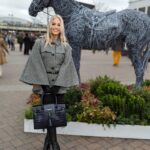Kimberly Wyatt Instagram - Immersed in the captivating world of the Cheltenham Festival, where exquisite fashion, electrifying ambiance, and the sheer brilliance of majestic equine reign supreme! Absolutely adoring my stunning Fairfax and Favor Sienna houndstooth cape, paired with the most incredible quality @fairfaxandfavor boots and gorgeous navy handbag. It’s a pleasure representing such a fabulous fashion brand amidst the magic of Cheltenham! 🐎✨ #CheltenhamMagic #EquestrianElegance #FairfaxandFavorFashion #ad