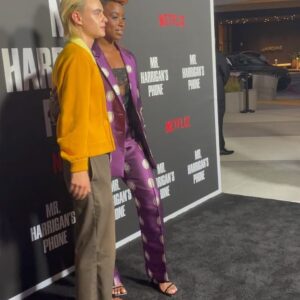 Kirby Instagram - 💜Purple Reign💜
Mr Harrigan’s Phone•Oct 5th @netflix 
📱📱📱📱📱📱📱📱📱📱📱📱
About this lewk: I messaged @lisoulondon (because her designs are stunning) who put me in touch with @collective.agencyla, who not only let me hand pick this suit, but also introduced me to the exquisite @larallan (who made this book clutch) and reunited me with @katmaconie. Vintage lingerie worn underneath, courtesy of my Nan who I’m now realising was quite the bad gyal 😈❤️

💁🏾‍♀️: @hairjunkierandy 
💄: @sage.white 
👠: @katmaconie 
👔: @lisoulondon 
📗/👜: @larallan