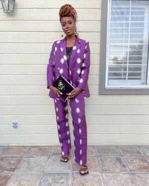 Kirby Instagram - 💜Purple Reign💜
Mr Harrigan’s Phone•Oct 5th @netflix 
📱📱📱📱📱📱📱📱📱📱📱📱
About this lewk: I messaged @lisoulondon (because her designs are stunning) who put me in touch with @collective.agencyla, who not only let me hand pick this suit, but also introduced me to the exquisite @larallan (who made this book clutch) and reunited me with @katmaconie. Vintage lingerie worn underneath, courtesy of my Nan who I’m now realising was quite the bad gyal 😈❤️

💁🏾‍♀️: @hairjunkierandy 
💄: @sage.white 
👠: @katmaconie 
👔: @lisoulondon 
📗/👜: @larallan