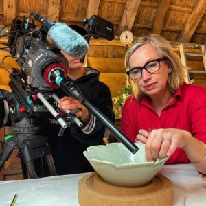 Kirsten Ramsay Instagram - We’ve said it before but the whole team behind the making of The Repair Shop are a super, talented bunch.

This image shows the care and trust involved in getting those incredible shots capturing our process.

Working in collaboration, we are able to show how we achieve the repairs and restorations.

It can be tricky with some techniques having to be captured first time round due to the types of adhesives or retouching materials being used, but everything you see is real!

On today’s program I had the absolute pleasure of meeting Jane a wonderfully talented potter.

What a joy to hear her describe her working techniques and I was able to help repair one of the first pieces that she made at the start of her career.

A beautiful incised, porcelain fish bowl and Jane, an absolute inspiration.

Camz on camera x … @rosycamz 

Catch up on @bbciplayer @therepairshoptv 
#conservation #restoration #repair 
#ceramic #ceramics #studiopottery 
#studioceramics #craft #craftpottery #conservatorsofinstagram #colourfill 
#probelens #closeup #kirstenramsay