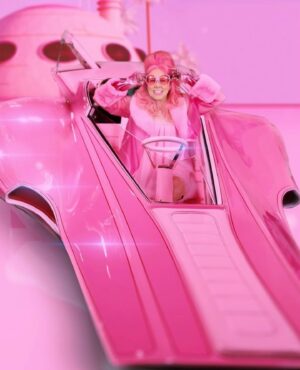 Kitten Kay Sera Instagram - One of my favorite pics from my feature in  @vogueportugal 💗 this is before  AI •artificial intelligence • I went to the car at a private location and we shot with it ! This is a one of a kind PINK PANTHER car .. very few get to pose in it !!!! It was such an honor 💗💗💗 the background art is by @grace_anim who also did my band @pinktasticplastixx logo ⚡️ in real life it was a car show room - enjoy the fantasy 
•
📷 by @jordanringphotography 
🫦hair & makeup by @sotellrob_mua