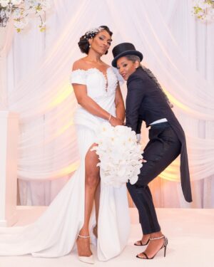 Kron Moore Instagram - So… we did a thang.👰🏾‍♀️🤵🏿‍♂️💍💜

Hair: @designer_elijah_ 
Unit: @kenya_styles 
MUA: @itsparasharde 
Skin: @luminousskinatl 
Gowns: @bridesbynona 
Shoes: @jimmychoo 
@geminiair14 ‘s MUA: @rachelreid.beauty 
@geminiair14 ’s  Hair: @kimberlythecreatork 
@geminiair14 ‘s Custom Tux: @beeombi 
@geminiair14 ‘s Shoes: @giuseppezanotti 
Coordinator: @_eventsbymesita 
Venue: @legendaryevents 
DJ: @liftoff__ 
Entertainment: @shaunrose_ 
Photography: @taunhendersonphotography 

#kronmoore #love #wedding #life #summer #atl #vowrenewalceremony