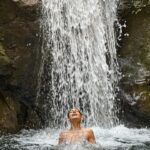 Kubbra Sait Instagram - 🎶 Let’s start with singing, “la la la laaaaa la la la la… lah lah lah!” 🎶 A little break taken into the wilderness of #IncredibleIndia This waterfall is remotely located deep into the forests and wilderness of the Gharwal region of Uttarakhand. We hiked about an hour & a bit, crossed a massive bridge in order to reach this little nest. I must admit… We were the only ripped people there… 😛 the other people were two friends who make Maggi and chai and also have now put up a rope to assist travelers to soak into the waterfall. I mean yah… (I am mixed about the maggi wala being there)… but, if not for the rope I would’ve easily chipped a tooth or something… and then… who would’ve done the iconic Liril shoot? Huh!?!?! When we got here (admittedly late) which made us take the beating of the Sun 🌞 we got maybe a teeny tiny head rush but no tan 😉 Our country is soooo beautiful and it turns out to be even more pretty when you can find a moment to get out of your own head and only look around with the eyes of your heart. ♥️ As always and forever @aquaterraadventures Thanks for suggesting this walk and immersion into crisp turquoise waters. I love you deeply and entirely. A massive shout out to Tanya and Harinder who walked the walk and then also shot real cute videos making this a trip to remember. #india #happiness #joy #love #laugh #live #adventure #waterfall #uttarakhand #gharwal #mountains Will you go searching for this jewel in the rocks?