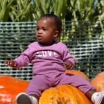 Lanisha Cole Instagram - Her smile is everything 🥹❤️✨🙌🏾 . Onyx went on her first #breastcancerawareness walk with Grandma yesterday 💕 . #breastcancerawarenessmonth #underwoodfamilyfarms #onyxice #coleandkuba #pumpkinpatch #halloweenweekend