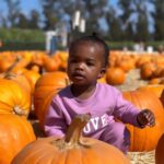 Lanisha Cole Instagram - Her smile is everything 🥹❤️✨🙌🏾 . Onyx went on her first #breastcancerawareness walk with Grandma yesterday 💕 . #breastcancerawarenessmonth #underwoodfamilyfarms #onyxice #coleandkuba #pumpkinpatch #halloweenweekend