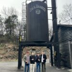 Lara Spencer Instagram - 10 shots (pun intended) of our Mother Son tour of Jack Daniel's Distillery. A fabulous history lesson and look at how this iconic American brand takes such pride in their product. Did you know every drop of Jack around the world is made right here in Lynchburg, TN? Handcrafted right down to the labels-- applied by HAND (see the video attached--I kept thinking of Lucy and the chocolates!). What a highlight to do a tasting with the Master Distiller and true rockstar Chris Fletcher and go up to the top floor of a very special barrel house, watch him DRILL into a barrel of 4 year old Tennessee Whiskey, and allow us to fill a bottle and taste. Learned so much. Laughed so much. Hopefully our boys will smile and remember our day every time they see a bottle of Jack. #oldnumber7 .