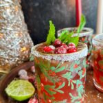 Laura Vitale Instagram – She is the moment yall 😮‍💨 my cranberry mojitos are the stuff of seasonal sparkly dreams!! Start with a simple syrup, then for each drink I muddle together the juice of half of a lime, 2 tbsp of simple syrup (or more of less depending on your preference) and a few mint leaves, then add a shot (or two I’m not driving nor judging ) of white rum, couple shots of cranberry juice and the juice of 1/2 an orange. Shake with some ice then pour into rimmed glasses and top with some fizzy flavored water of choice. It is sensational and you will love ittttt!!!!