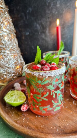Laura Vitale Instagram - She is the moment yall 😮‍💨 my cranberry mojitos are the stuff of seasonal sparkly dreams!! Start with a simple syrup, then for each drink I muddle together the juice of half of a lime, 2 tbsp of simple syrup (or more of less depending on your preference) and a few mint leaves, then add a shot (or two I’m not driving nor judging ) of white rum, couple shots of cranberry juice and the juice of 1/2 an orange. Shake with some ice then pour into rimmed glasses and top with some fizzy flavored water of choice. It is sensational and you will love ittttt!!!!