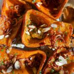 Laura Vitale Instagram – Buon pomeriggio my beautiful peeps!! I wanted to share this easy roasted honey nut recipe I’ve made more times than I can count and it’s just so easy but the balance of sweet, spicy and crunchy just get me every single time!! Halve and hollow out some honey squash (any squash works for this by the way) plop them on a lined baking sheet, oil and heavily salt the cut side, turn them over and roast at 400 about 40 minutes depending on the side or until super soft, then flip them over, drizzle a tad bit of maple syrup and stick them under the broiler for a minute to caramelize them. 
While those roast fry up lotsssss of shallots and red pepper flakes in some neutral oil until golden brown, then remove the shallots with a slotted spoon on a paper towel lined plate (reserve the oil to cook with or use on anything!) when ready to serve top the squash with the crispy chili shallots, toasted almonds (or pecans ) some parsley and another drizzle of maple syrup or hot honey. Unbelievably YUM!! I promise!! 
#lvturkeyday2023 

#food #foodporn #foodie #instafood #foodphotography #foodstagram #yummy #foodblogger #foodlover #instagood #love #delicious  #homemade #dinner #foodgasm #tasty #photooftheday #foodies  #cooking  #picoftheday #foodpics #instagram #fall #fallfood #thanksgiving #thanksgivingfood #recipe #recipes #easyrecipes