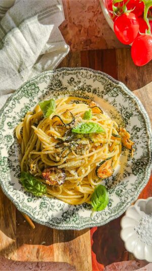 Laura Vitale Instagram - Comment BOOK (no character after the word or it won’t work) and I’ll send you the link directly to make it easier for you (yall really love this feature and I’m so happy❤️❤️❤️❤️) this recipe is such a star and requires very few ingredients but cooked just right creates absolute magic!!! Sitting here eating a bowl of this spaghetti alla nerano-ish transports me to warm summer days sitting at my favorite place in the magic that is Italy and just the thought of that makes life better ❤️ ingredients below, full recipe /instructions and inspo to live your very best life is found At My Italian Table ❤️❤️

1/2 cup extra virgin olive oil 
1 garlic clove 
1.5lb small zucchini thinly sliced 
1/4 cup of grated parm
1/4 cup of grated pecorino 
Few basil leaves 
Salt to taste and plenty of black pepper if you’d like!