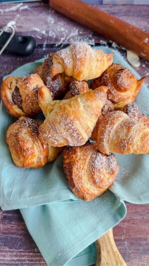 Laura Vitale Instagram - Here’s a reminder that probably the best project on a cold cold winter day is to make fresh croissants. I don’t make them in the warmer months because the key is to keep that butter cold and fold and roll to create all those flaky layers. Listen I’m no professional, I just know good food and these are absolutely SENSATIONAL!! Full recipe on my site, detailed video to go with it, stuff with Nutella, crema pasticcera or jam and you will be obsessed!!