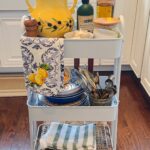 Laura Vitale Instagram – Buongiorno!! Set up my outdoor cooking cart with me! I think of this little cart like the countertop in my kitchen, it holds all the little things I would constantly run back and fourth in the kitchen for, this way it’s all in one place, I roll it wherever I need it, and it holds my essentials (just like my countertop in the kitchen) pots and pans I grab what I need for what I’m cooking but other than that, this little cart holds my basics I use all day every day for pretty much everything I cook. I always need some plates and shallow bowls either for prepped ingredients or to place things in, silverware to grab and go and everything else I need at the ready! Do you this too? It saves me with all the cooking I do outside because otherwise I’d lose my mind 🤣 I’ll link my cart in stories for you (the utensil holder is an old Italian cookie jar but I linked similar versions for you and all saved to kitchen things highlights) ❤️