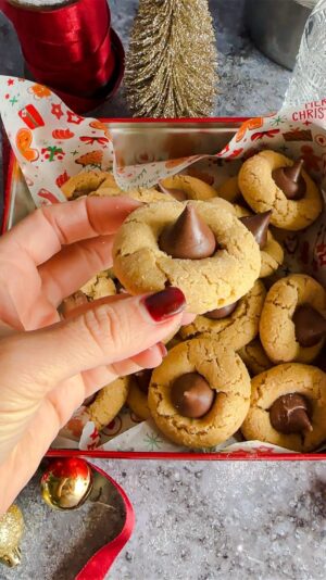 Laura Vitale Instagram - Peanut butter blossoms of dreams!! I have no used any other nut butters or substituted any ingredient, these are the only way I’ve ever made them so if you tailor the recipe know they might not come out the same. It’s also crucial you use a creamy peanut butter (like skippy) and not a natural peanut butter because the end result is not as good. If you plan on freezing the dough,just leave the balls of dough on the baking sheet in the freezer for a couple hours then place then in a large zip lock bag and keep frozen until needed, when you go to bake them bake them at 375 for 10 minutes (you’re just baking them 2 extra minutes) and they are perfection!! 

Yields about 3 dozen 
1/2 cup (one stick) of unsalted butter, softened 
1/2 cup of creamy peanut butter
1/2 cup of granulated sugar 
1/2 cup of brown sugar 
2 tsp of vanilla
2 large eggs 
2 cups of all purpose flour 
1/2 tsp of salt
1 tsp of baking soda 
Chocolate kisses 💋