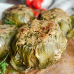 Laura Vitale Instagram – In this house, we keep recipe traditions alive especially around the holidays. Artichokes are alwaysssssssss on the table at Easter, either boiled (or steamed) or stuffed (and most of the time both) and they are so sensational you can’t even imagine!! I don’t really measure the filling (but i hope to shoot it for you in depth this week if time allows because I make them all spring long!!) breadcrumbs , cheese, garlic, parsley, lots of oil and good pinch of salt. Cook low and slow in enough water and to come up half way and a good drizzle of oil and healthy pinch of salt. Keep topping off the water to keep it at that halfway mark, cook about an hour and if you’d like (and I recommend) broil for a few minutes. Serve with some of the brothy water drizzled over the top and live your best life one bite at a time babes 😍