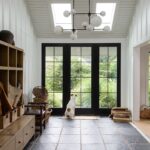 Lauren Liess Instagram - Oh hi there Saturday 🤍 Not much more time living here and I’ve realized the thing I’ll miss the most is the massive foyer/ mudroom. (Our house is a dogtrot and this area used to be an exterior walkway between the two halves of the house.) there is so much SPACE and storage and we’re going to have to reign it in a bit at the next place 🤍 | photo by @helennorman