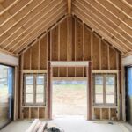 Lauren Liess Instagram – Silhouettes at the meadow 🤎 Things are taking shape!! The orangery off the garden is through a moongate from the family room. It will be anchored on the far side by a big ol’ fireplace. We’re doing a combination of modern doors by @otiima_usa   antique reproduction oak windows by @parrettwindows and more are going in each day letting the light in!! I’ve been sharing Meadow progress videos on our you T u be channel so be sure to check it out if you want all the details! 🤎 renovation by @carrmichaelconstruction