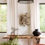 Lauren Liess Instagram - The striking simplicity of sculptural forms is something I love playing with. When we moved last time it became apparent how many sculptural objects I’ve amassed throughout the years… It looked a bit like Medusa’s garden with all the heads/ people / animals 🤣 {photo from my newest book - FEELS LIKE HOME- of our #houseinthewoods @propertycollective project 📷 @helennorman }