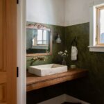 Lauren Liess Instagram - Little bit o’ texture in this farmhouse powder room 🌿 Venetian plaster vintage and reclaimed elements the trough sink from my collection with @atmosphyre_home (if you zoom in you can see see the beautiful LL logo James imprints on the back of each sink) #wisconsinfarmhouseproject designed by us @laurenliessandco