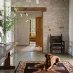 Lauren Liess Instagram – One of my favorite spaces we’ve ever done ~ the foyer in our #wisconsinfarmhouse project 🤍 vintage   antiques   a “metamorphosis” foyer console that can transform into a full dining table when needed for carryover dining (it’s the opposite of a drop leaf and is from my collection with @woodbridgefurniture ) 🤍🌿 photo by @helennorman | designed by us @laurenliessandco {we get asked all the time if we are taking in new projects and travel and the answer is yes and yes! We’re always looking to work with clients who share our love for nature, real humble materials, and down to earth, soulful living and need their homes designed 🤍 Over half of our projects are out of state 🤍)
