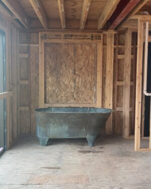 Lauren Liess Instagram - The CORRECT 200-something-year-old tub has arrived at the Meadow!! 🛁And it is green!! (Phew!!) I’ve been going back and forth internally on its positioning… I have always planned for it to span left-to-right in front of the back window (1st video/ 2nd slide) but can’t forget how much I loved baths in our old tub which faced straight out out a (side) window so I’ve been wrestling with facing it towards the back window (3rd   4th slides). The glass door to the left side will lead to a walled-in garden with outdoor showers in it and the back window (not in yet) looks out to the back yard. I love the silhouette of the tub when it’s sideways and space-wise it fits the room perfectly but I can’t unsee the thought of those facing those views straight on. Here it is both ways and I’m 99.9% on team facing the views now. It somehow feels more authentic to me, having the tub face the way we will naturally want to look but I’m a little sad to see less of the tub straight on and I don’t love having my back to the room. Something I’ve written a bit about in the past is that there are some spaces where the “enjoyment” arrangement (the one you will be using and enjoying while in the space) isn’t as pretty upon entry or to look at… in these cases I think about pros and cons (enjoyment in the room usually wins unless it’s just way too awkward-feeling.) I’ll be posting a video update of our final decision once it’s made… what would you do?? Are you on Team sideways or Team Views?? 🫧 {Also, if you haven’t seen it, our first Meadow House episode is up on y o  u. T ube!