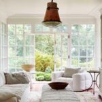 Leanne Ford Instagram - At home with my Mellow Chairs — part two! Our home’s sun room has become the room where my family and I like to cozy up together the most. We read books, watch shows, color and just get really cozy, cozy, cozy here! So, when I got my hands on some samples of the Mellow Chair that I’d been designing with @crateandbarrel (in the hope to create the coziest chair imaginable), I knew they had to go in this room! I paired the Mellow Chair with my Ever Sofa and even swapped out the coffee table that was originally here for two of the Mellow Ottomans lined up next to one another — now we can quite literally kick our feet up and relax here. This room was always a space that we naturally gravitated to and now we just might never leave! // #LeanneForCrate shot by @amyneunsinger with interior styling by @hilaryrobertson