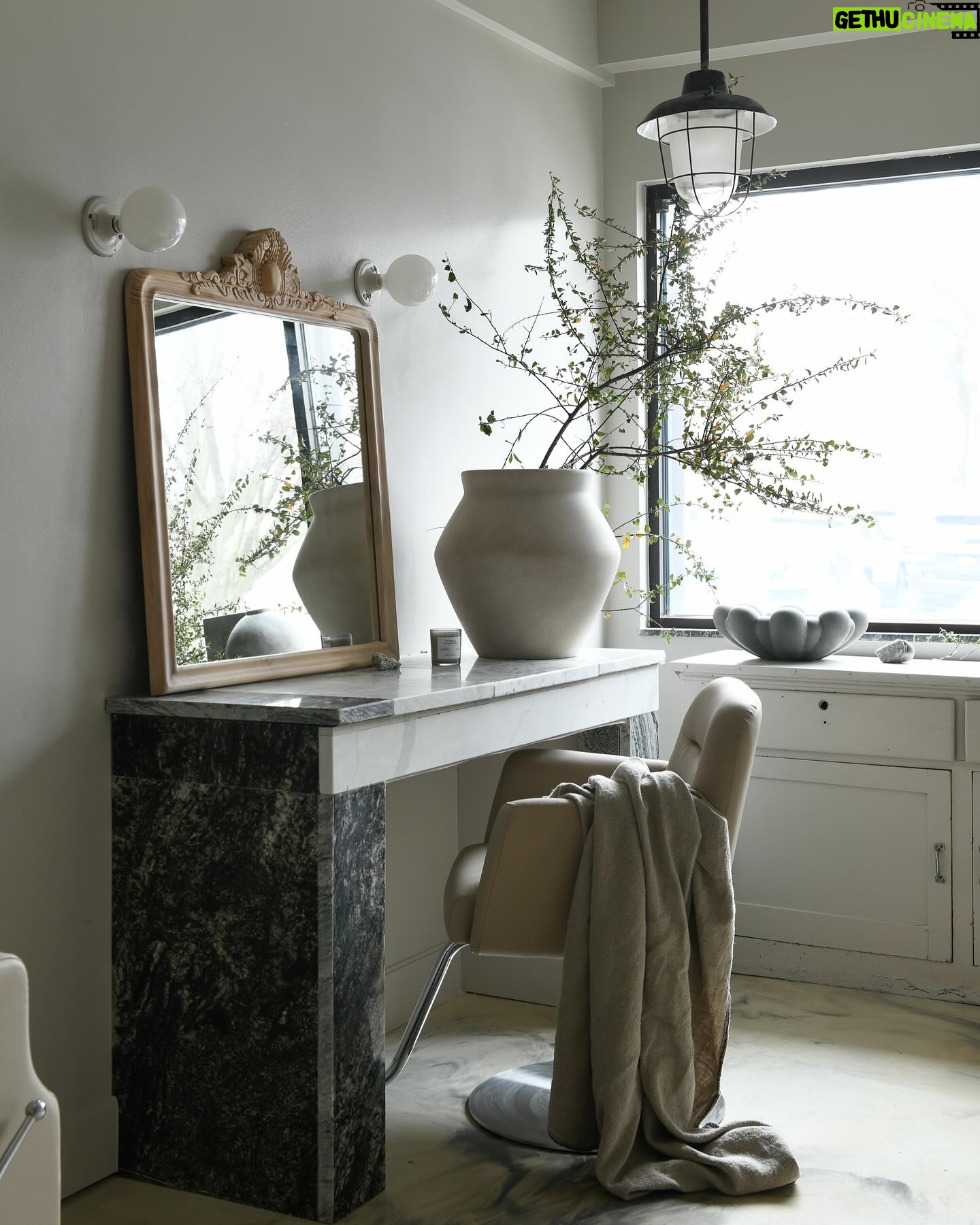Leanne Ford Instagram - When we got started on this project they had already painted the walls and epoxied the floors, so we made that our main source of inspiration — leaning into all the warm earthy tones already there. To do this we found all these salvaged marble pieces and pieced them together to make different pieces of furniture like the vanity you see here. Anything can be anything! Swipe to see the marble graveyard we pulled all of these pieces out of — it was our kind of gold mine (ya know how it goes....one man’s trash, another man’s treasure)! //#LeanneFordInteriors shot by @erinashkelly and styled @_mon_modern______