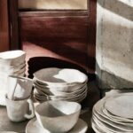 Leanne Ford Instagram - I love seeing these two different dinnerware collections that I designed with @crateandbarrel side by side like this! Both are beautifully made (tonal) ceramics but they ultimately have their own distinct feeling and look. And now I’m wondering, is your home a Range or Kiln collection kind of home? I am admittedly a dinnerware kind of girl so mine’s a “depends on the day” kind of home! // #LeanneForCrate shot by @amyneunsinger and styled by @hilaryrobertson