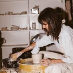 Leanne Ford Instagram - My most personal addition to this collection has got to be the Kiln Dinnerware Set — prototyped by yours truly in my very own ceramic studio (basement!) I by no means am a “true” ceramicist but I love to play on the wheel and with different glazes and forms. I basically hacked the system by convincing @crateandbarrel let me produce these pieces at scale in Portugal! For months I sat at the wheel and created version after version until I got it just right (perfectly wonky — just the way I like it) and then I would carefully pack that little prototype up and ship it off to the @crateandbarrel headquarters and they would take it from there. // #LeanneForCrate shot by @amyneunsingerwith interior styling by @hilaryrobertson — Studio shoot shot by @sarahbarlow for @feelfree