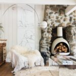 Leanne Ford Instagram - Want to hear something crazy- This fireplace was made from scratch. There was no fireplace when I got #thelittlecabininthebigcity! But there was the ghost of one on the outside wall. There were also loads of beautiful stones out in the yard. Are you thinking what I’m thinking?! Presto. A new/old fireplace was born! The #malm fireplace inside was my creative way to make it safer while meshing my many styles in this little place. // #LeanneFordInteriors shot by @tessaneustadt